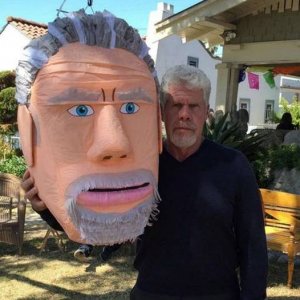 the real ron perlman is on the left because he does have a big head
