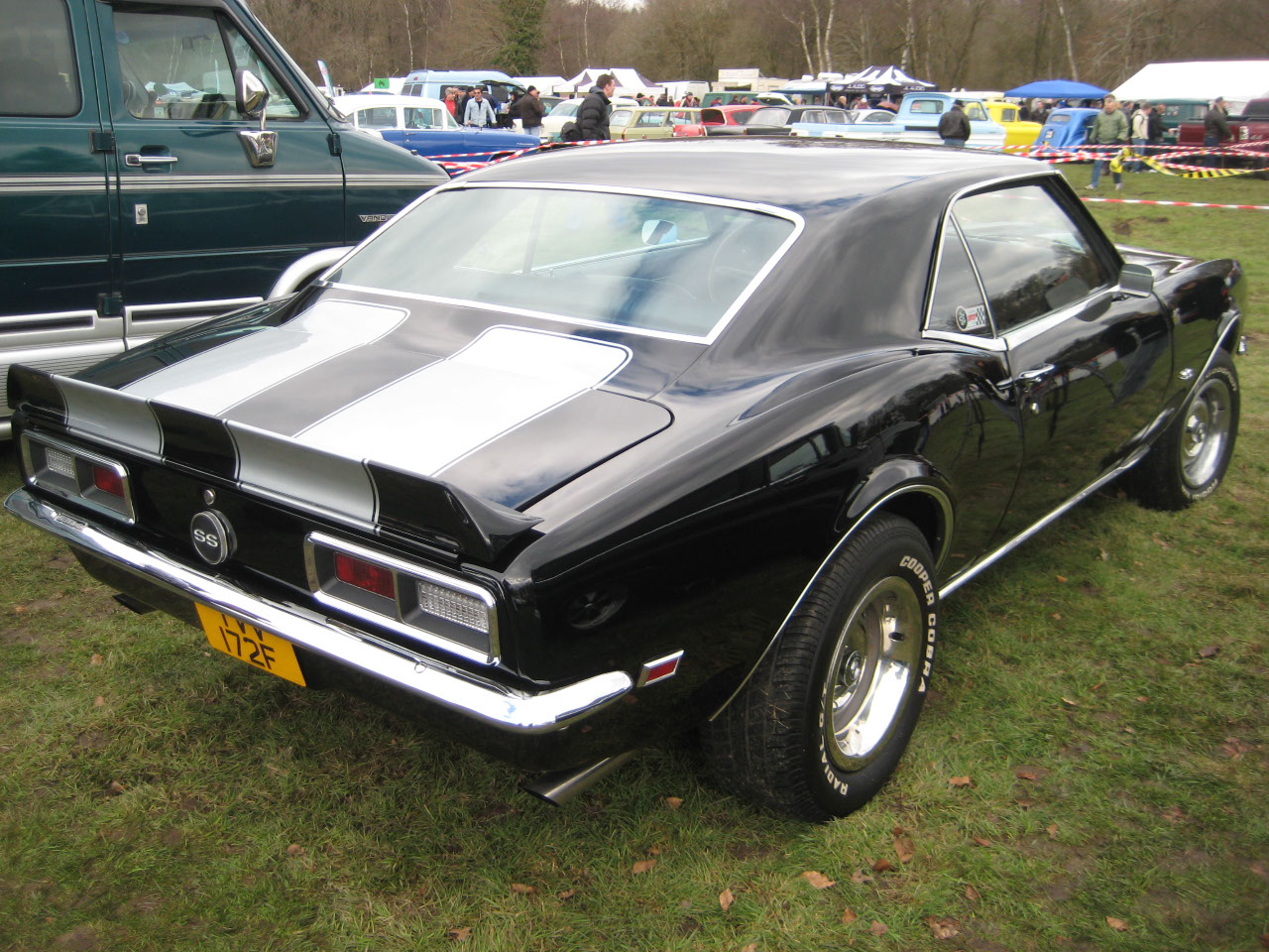 Black with silver racing stripes, 60's Chevy Camaro
