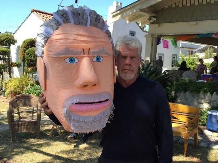 the real ron perlman is on the left because he does have a big head